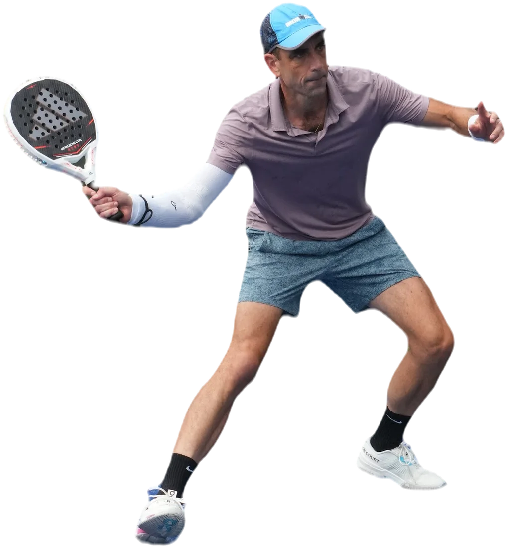 PadelEdge Academy member reaching a forehand